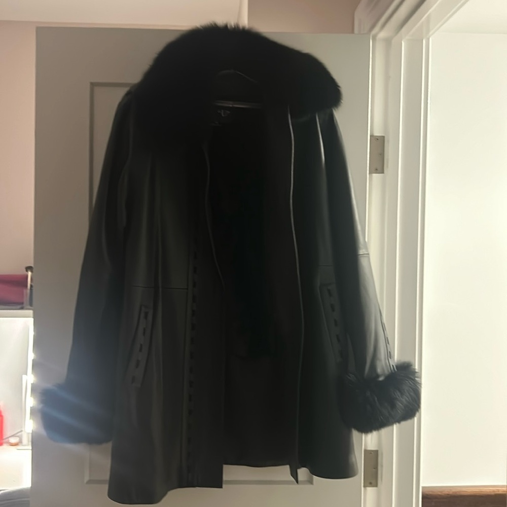 New condition vintage leather and fur lined long jacket
